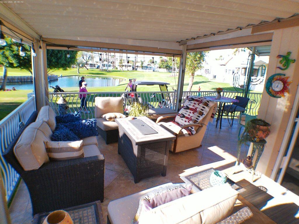 84136 Ave 44, Unit 262 Indio, CA 92203 - Photo 19 of 60 a living room with patio furniture and a large window