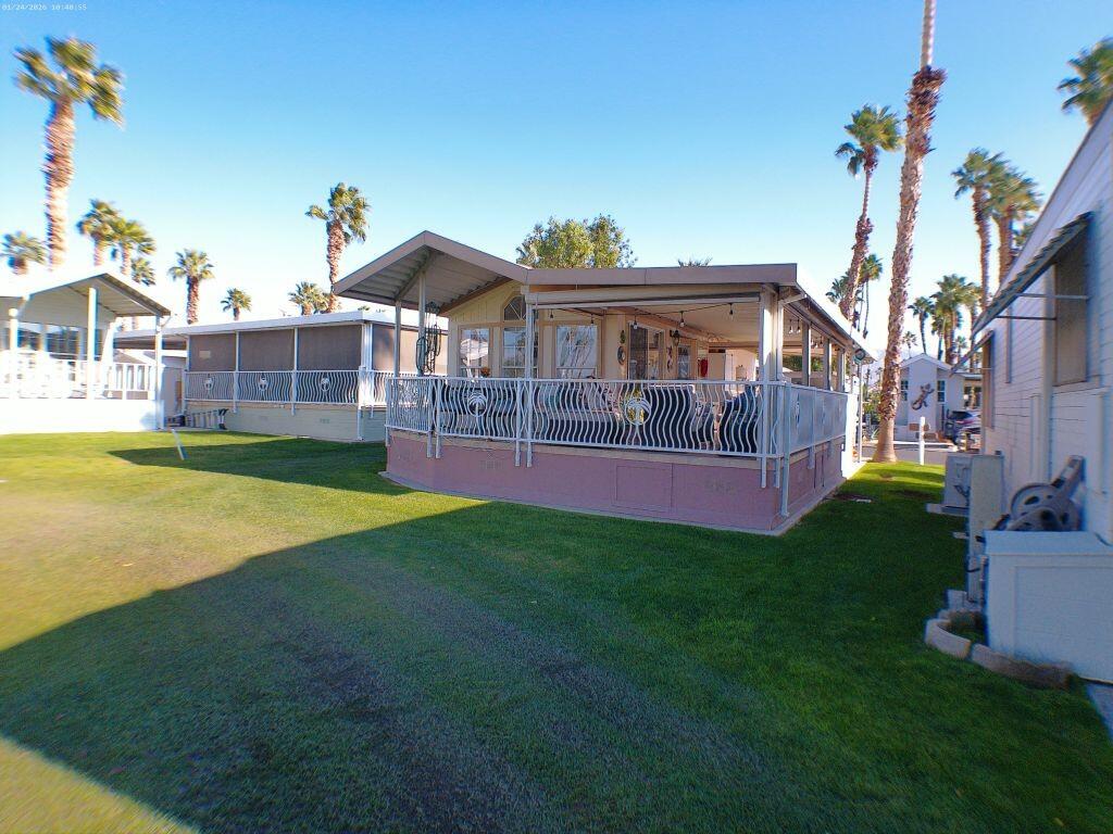 84136 Ave 44, Unit 262 Indio, CA 92203 - Photo 2 of 60 a view of a house with a yard porch and sitting area