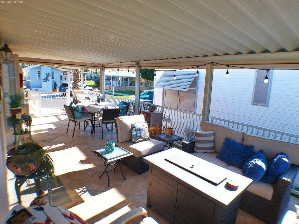 84136 Ave 44, Unit 262 Indio, CA 92203 - Photo 22 of 60 a living room with furniture and a large window