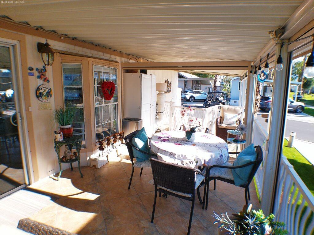 84136 Ave 44, Unit 262 Indio, CA 92203 - Photo 26 of 60 a view of a dining room with furniture and chandelier