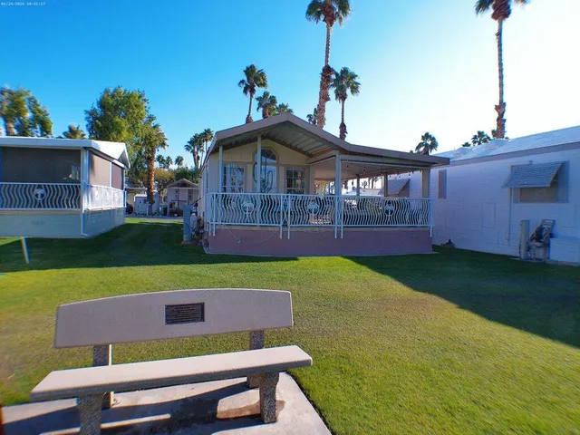 a view of house with backyard and entertaining space