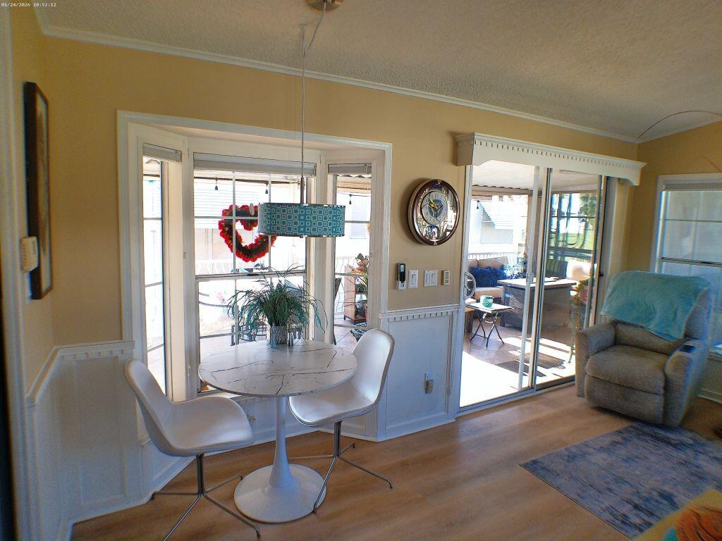 84136 Ave 44, Unit 262 Indio, CA 92203 - Photo 40 of 60 a living room with furniture a clock and a large window