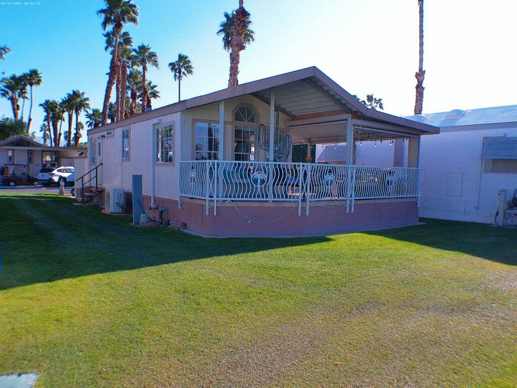 84136 Ave 44, Unit 262 Indio, CA 92203 - Photo 4 of 60 a view of house with backyard and entertaining space