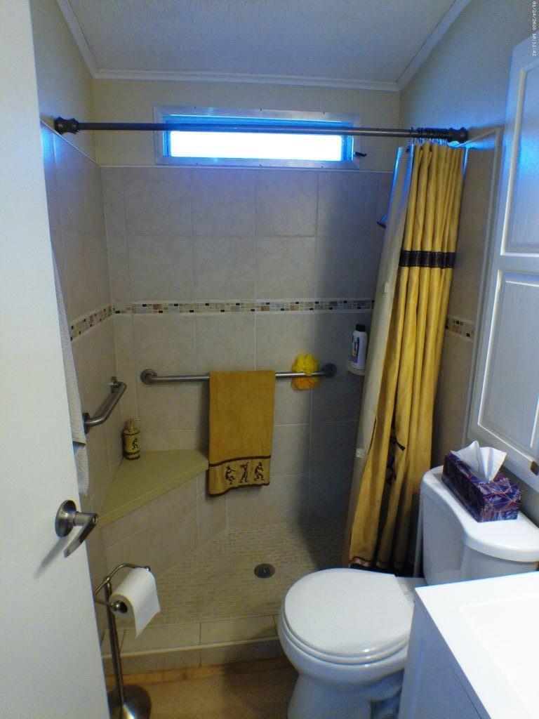 84136 Ave 44, Unit 262 Indio, CA 92203 - Photo 42 of 60 a bathroom with a toilet and a shower
