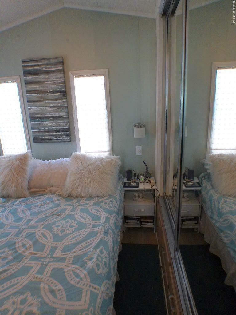 84136 Ave 44, Unit 262 Indio, CA 92203 - Photo 44 of 60 a bedroom with a bed and a window