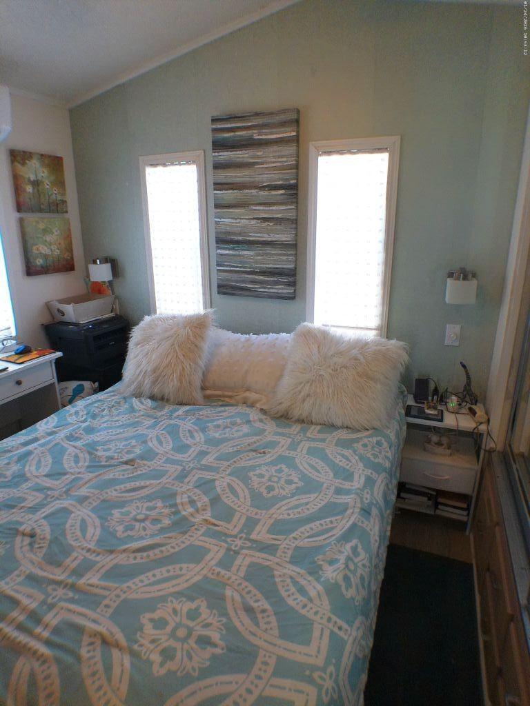 84136 Ave 44, Unit 262 Indio, CA 92203 - Photo 46 of 60 a bedroom with a bed and a couch