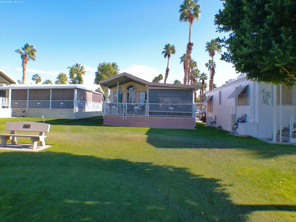 84136 Ave 44, Unit 262 Indio, CA 92203 - Photo 58 of 60 a view of a house with a backyard porch and sitting area