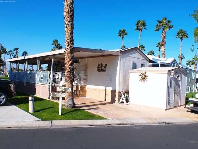 a view of a patio with a dining table and chairs