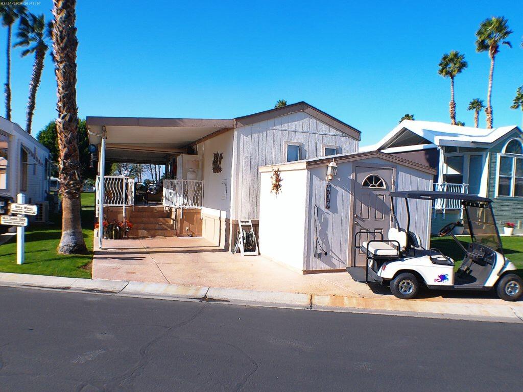 84136 Ave 44, Unit 262 Indio, CA 92203 - Photo 9 of 60 a car parked in front of a house