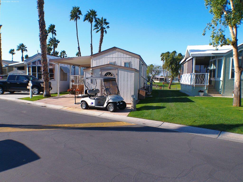 84136 Ave 44, Unit 262 Indio, CA 92203 - Photo 10 of 60 a view of a house with a yard and sitting area