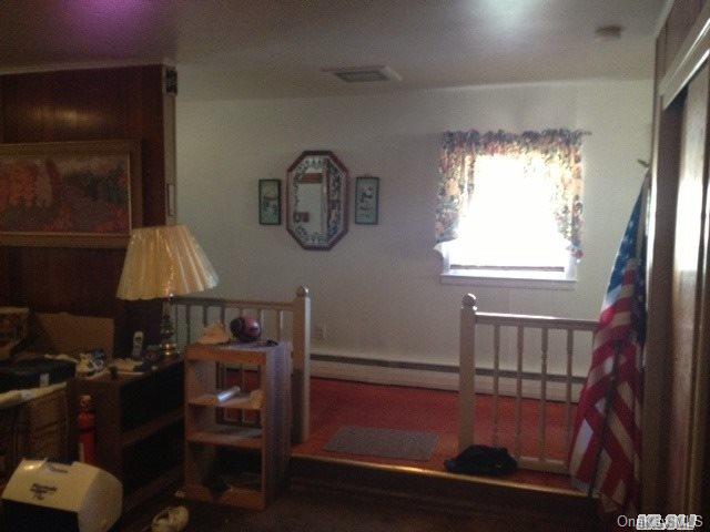 135-47 124th Street Queens, NY 11420 - Photo 12 of 17 a room with furniture and a window