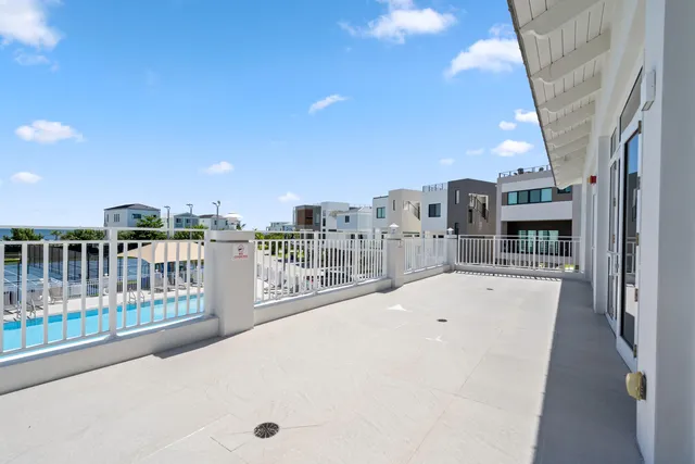 a swimming pool with outdoor seating and yard