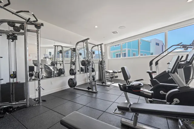 a view of a house with pool and chairs