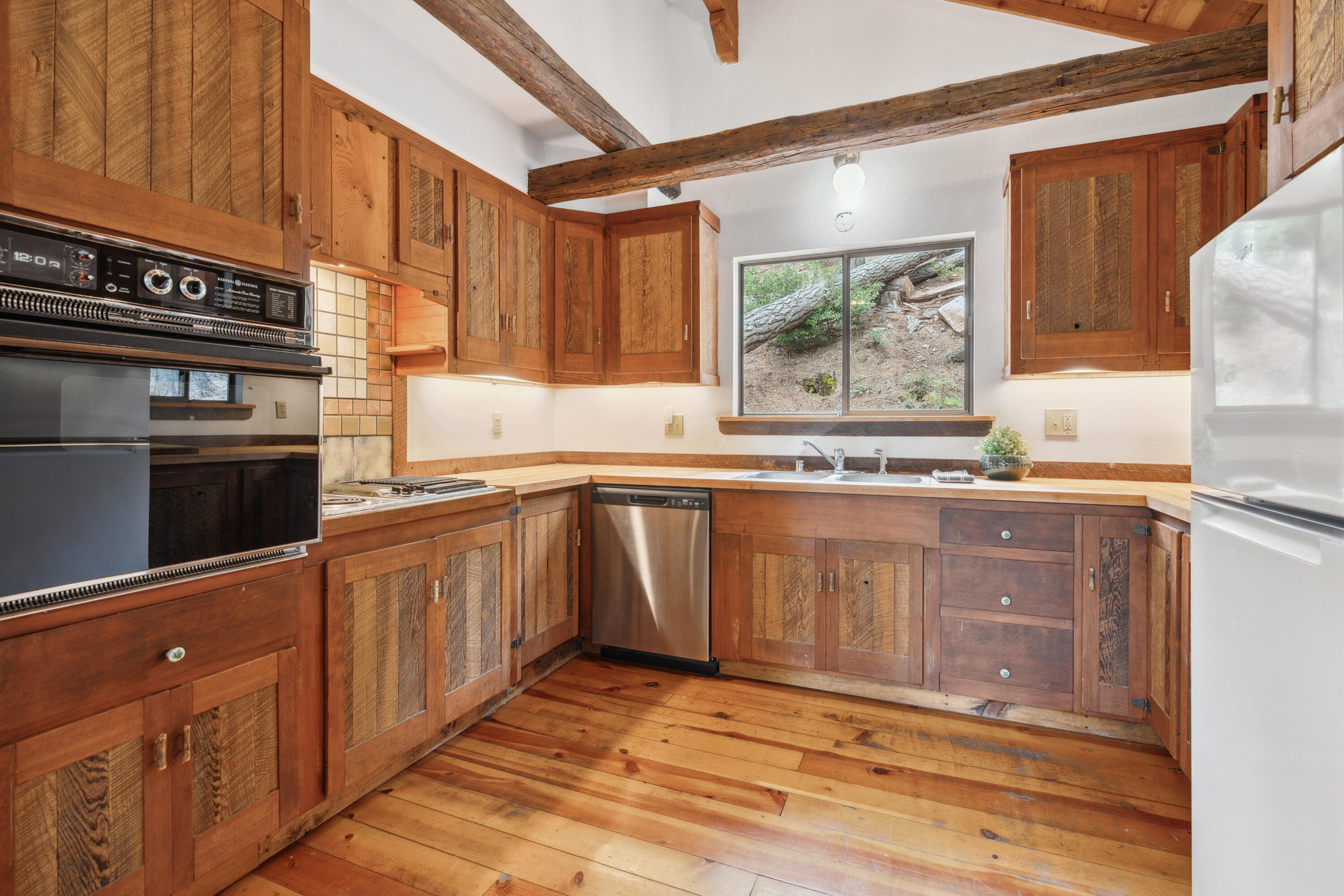 2120 Pack Trail Mount Shasta, CA 96067 - Photo 12 of 92 a kitchen with stainless steel appliances granite countertop a stove a sink and a microwave