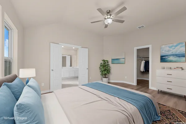 a bedroom with a bed and a couch