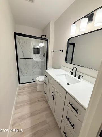 a bathroom with a double vanity sink and mirror