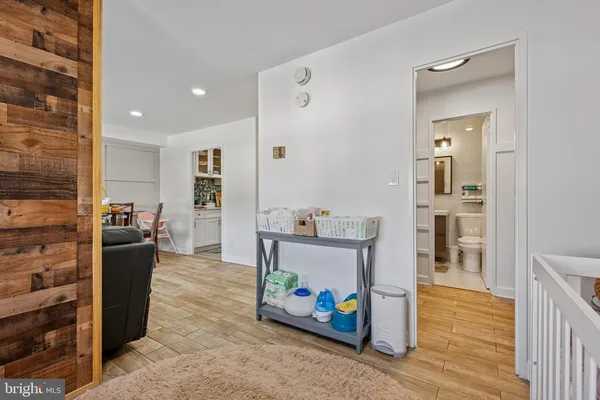 a kitchen with stainless steel appliances granite countertop a sink and a refrigerator