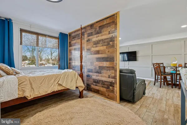 a bedroom with a bed and window
