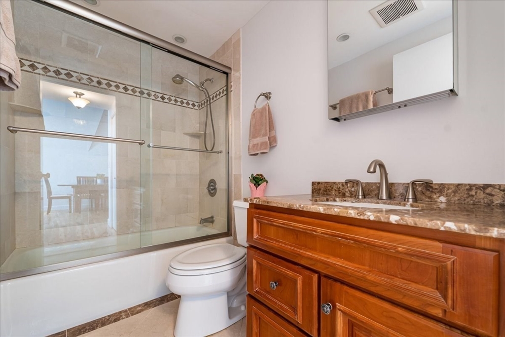 130 Appleton Street, Unit 4E Boston, MA 02116 - Photo 12 of 17 a bathroom with a sink a toilet and shower