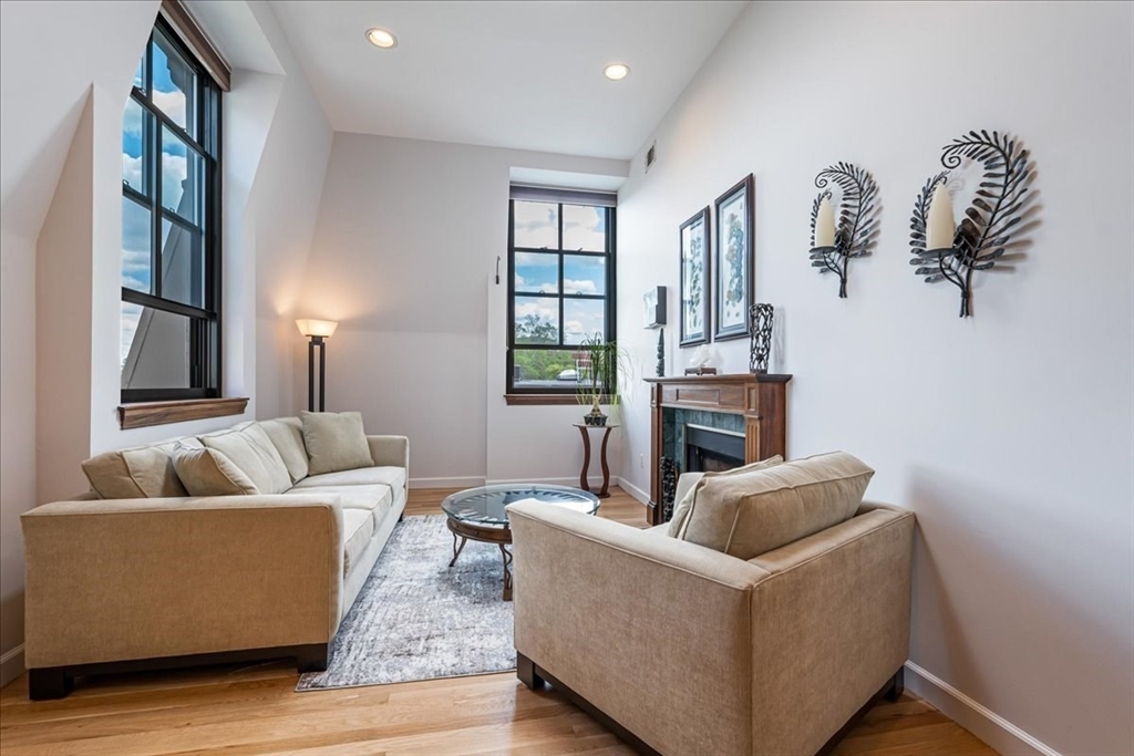 130 Appleton Street, Unit 4E Boston, MA 02116 - Photo 2 of 17 a living room with furniture and a fireplace