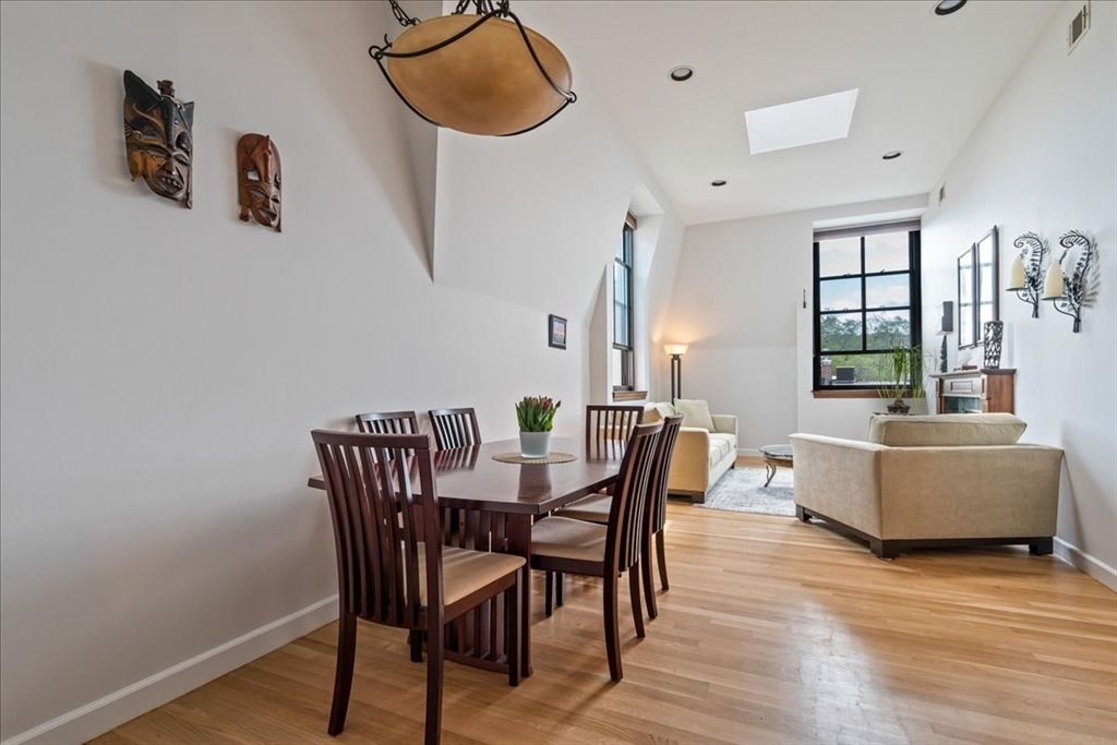 130 Appleton Street, Unit 4E Boston, MA 02116 - Photo 4 of 17 a view of a dining room with furniture and wooden floor