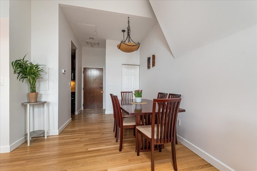130 Appleton Street, Unit 4E Boston, MA 02116 - Photo 5 of 17 a view of a dining room with furniture and wooden floor