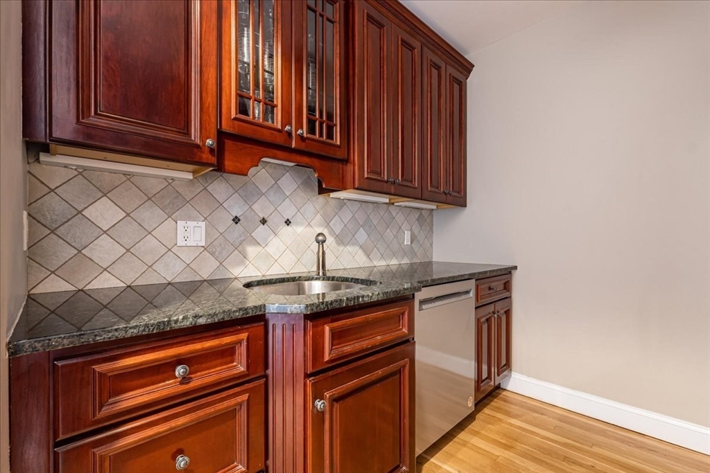 130 Appleton Street, Unit 4E Boston, MA 02116 - Photo 7 of 17 a kitchen with granite countertop cabinets and window