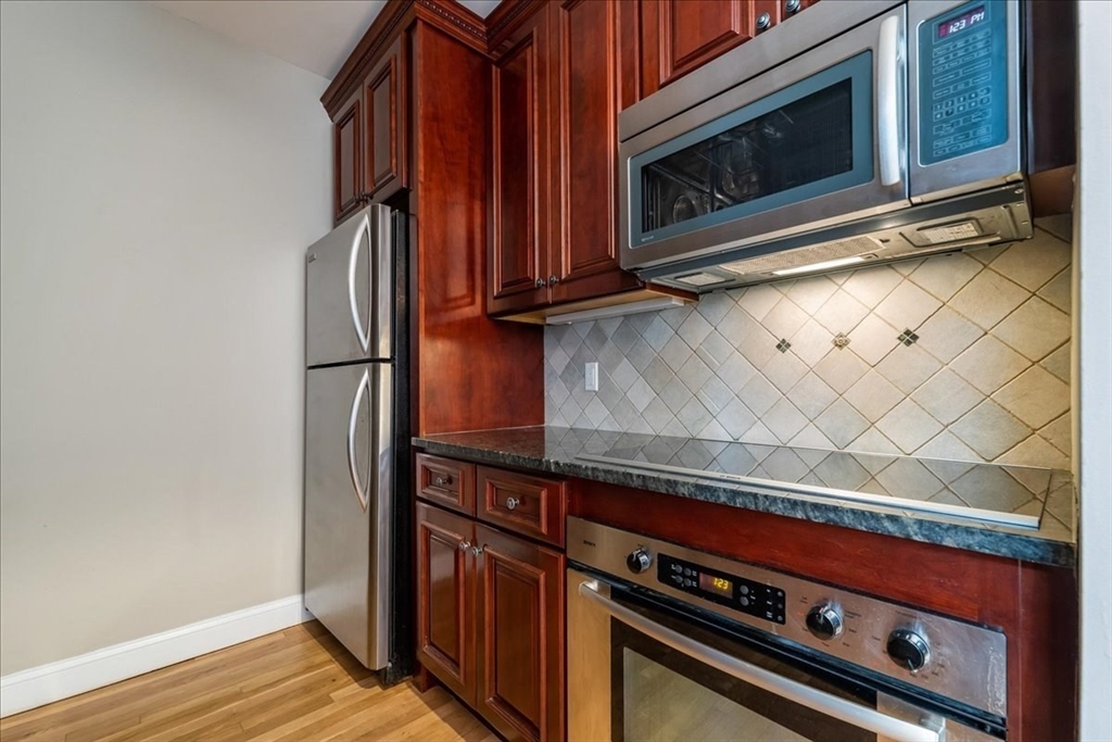 130 Appleton Street, Unit 4E Boston, MA 02116 - Photo 8 of 17 a stove top oven sitting inside of a kitchen