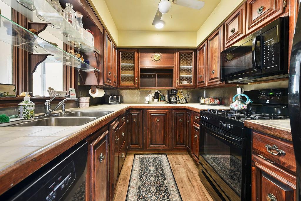 139 Camp Run Road Harmony, PA 16037 - Photo 15 of 41 a kitchen with stainless steel appliances granite countertop a sink a stove and a microwave