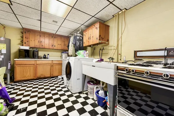 a kitchen with a sink a stove and a refrigerator