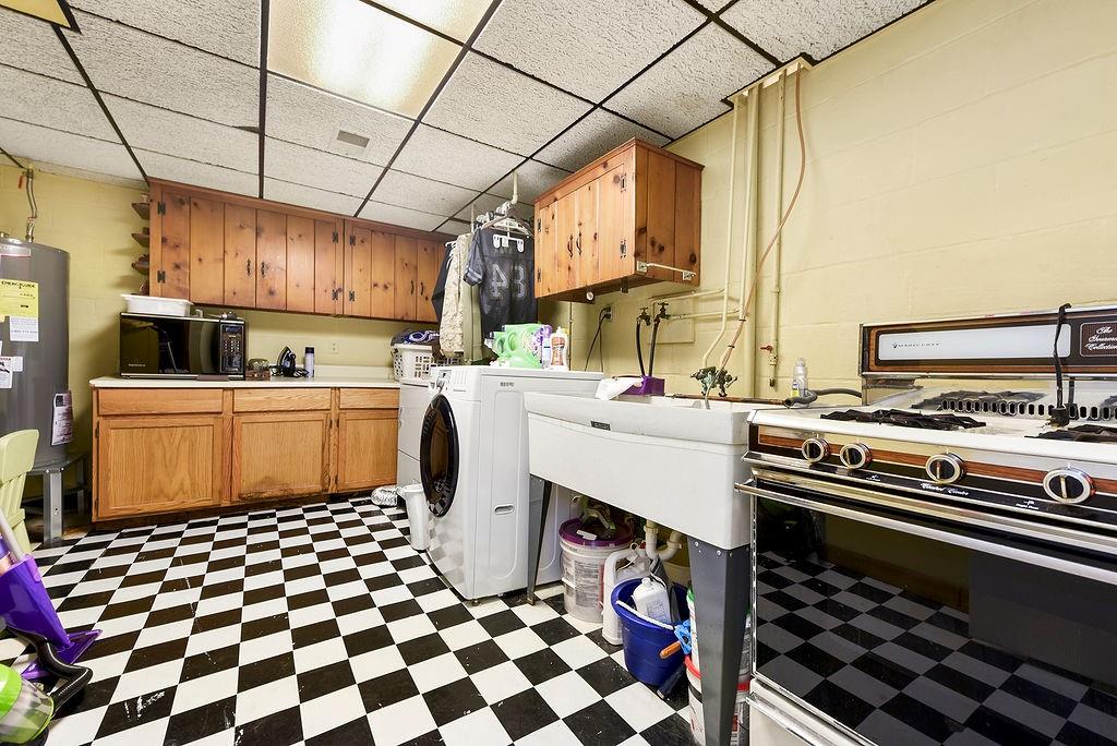 139 Camp Run Road Harmony, PA 16037 - Photo 27 of 41 a kitchen with a sink a stove and a refrigerator