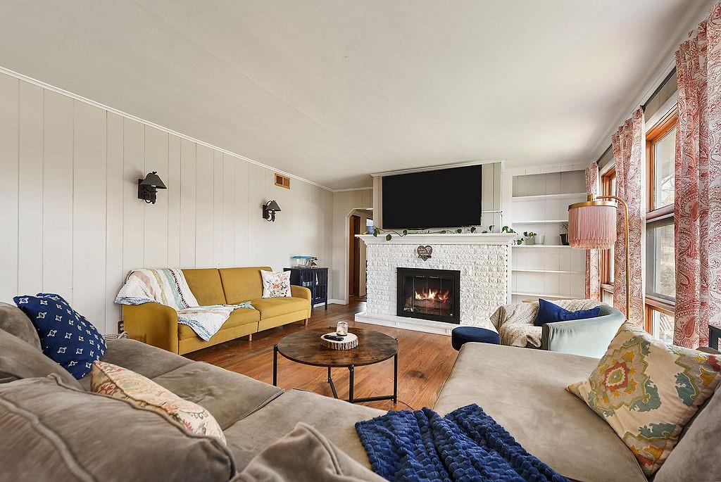 139 Camp Run Road Harmony, PA 16037 - Photo 4 of 41 a living room with furniture a fireplace and a flat screen tv
