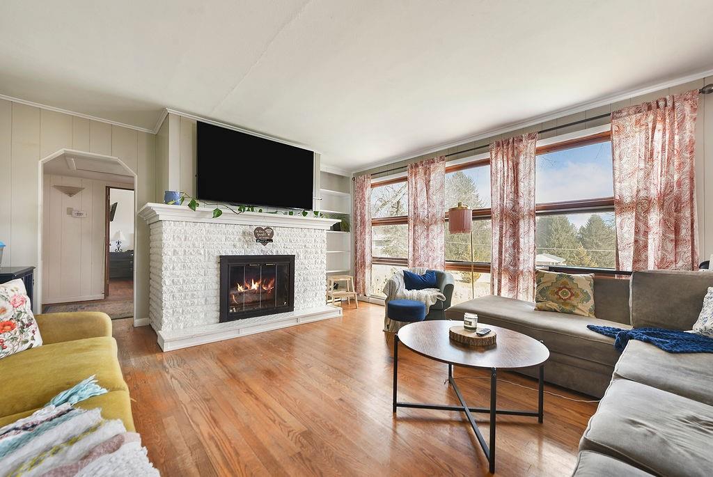 139 Camp Run Road Harmony, PA 16037 - Photo 6 of 41 a living room with furniture a flat screen tv and a fireplace