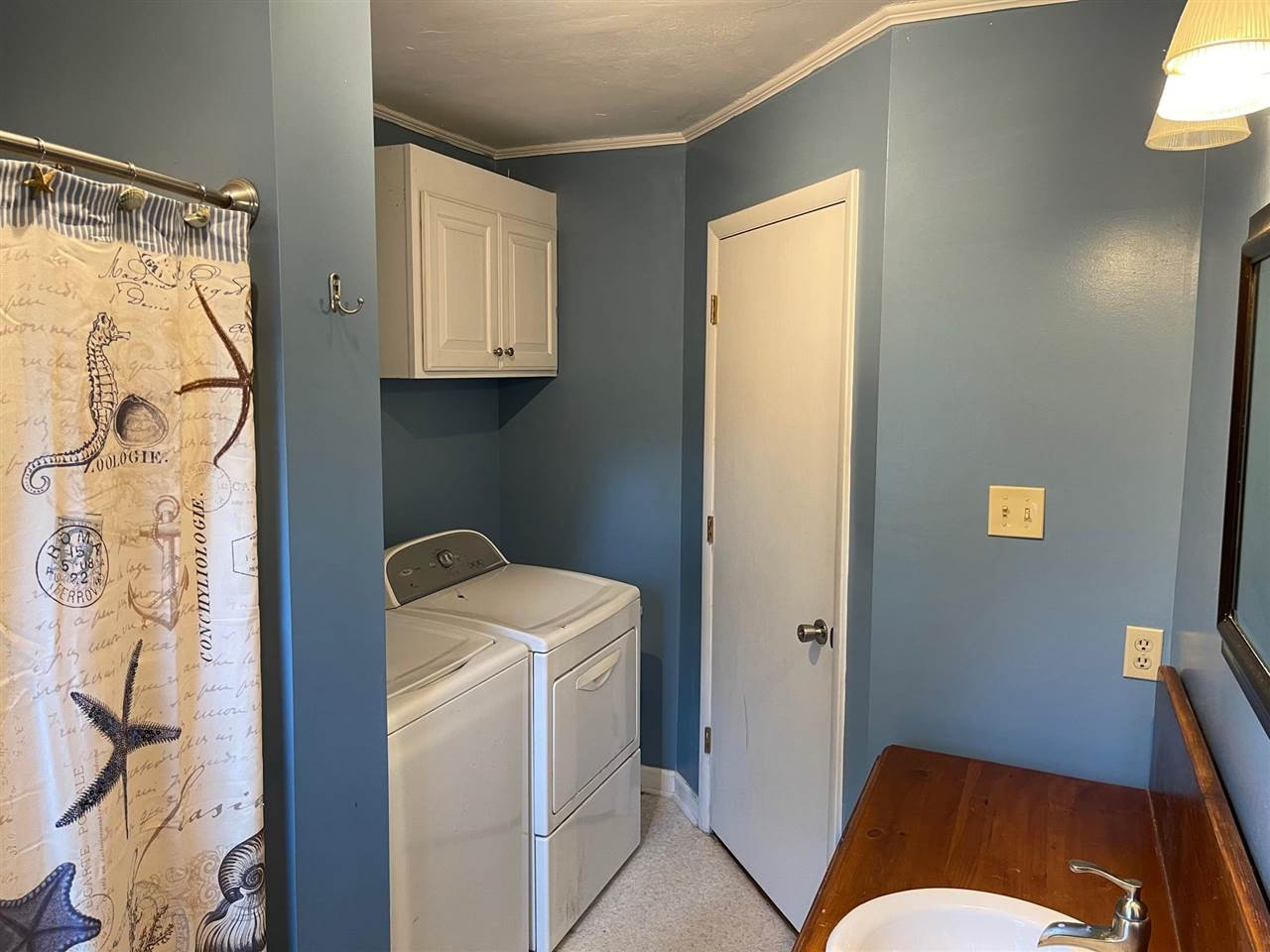 7931 Elevation Road Benson, NC 27504 - Photo 14 of 15 Bathroom and laundry room