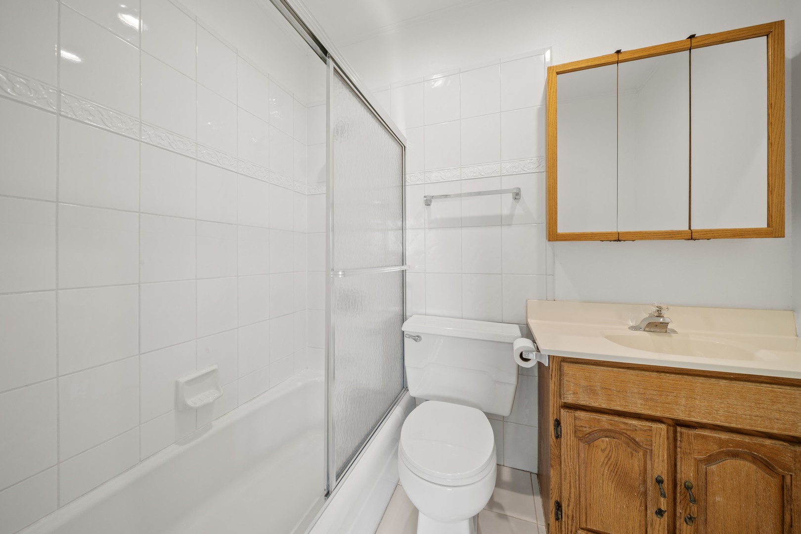 10381 Dearlove Road, Unit 2A Glenview, IL 60025 - Photo 12 of 19 a bathroom with a sink a toilet and shower