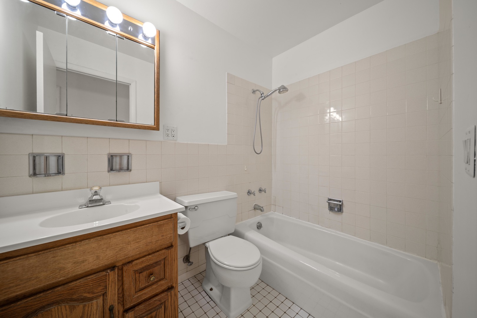 10381 Dearlove Road, Unit 2A Glenview, IL 60025 - Photo 14 of 19 a bathroom with a sink toilet vanity and shower
