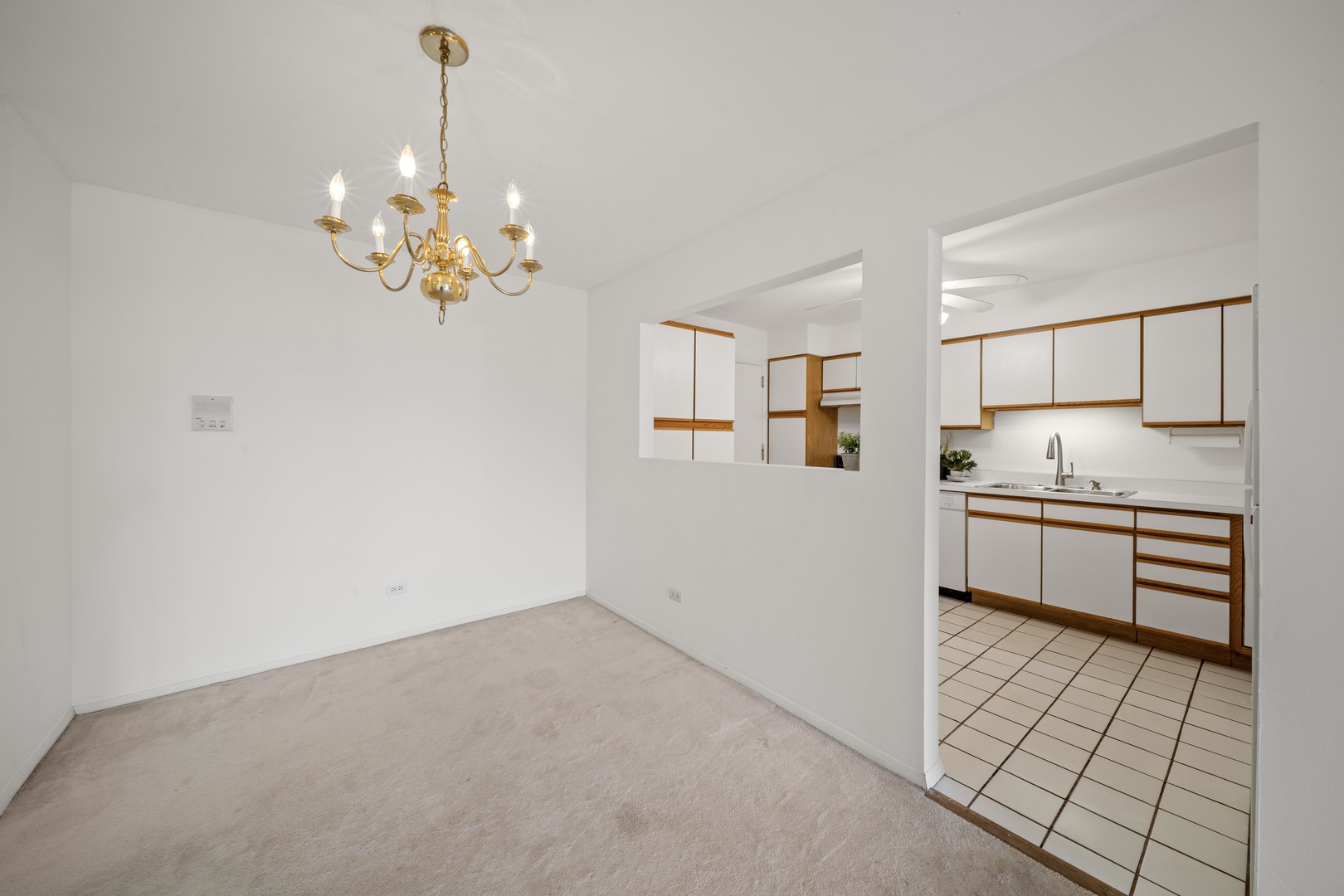 10381 Dearlove Road, Unit 2A Glenview, IL 60025 - Photo 4 of 19 a kitchen with stainless steel appliances granite countertop a stove a sink and a refrigerator