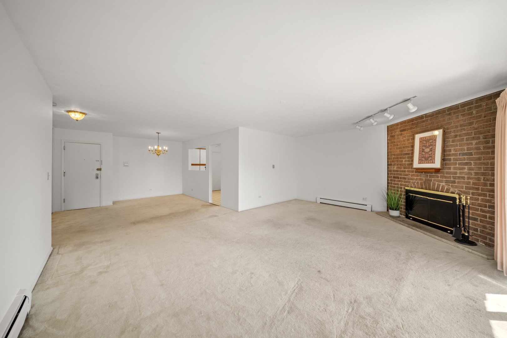 10381 Dearlove Road, Unit 2A Glenview, IL 60025 - Photo 6 of 19 a view of empty room with a fireplace