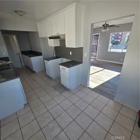 a living room with a couch and a stove top oven