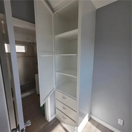 a view of an empty walk in closet