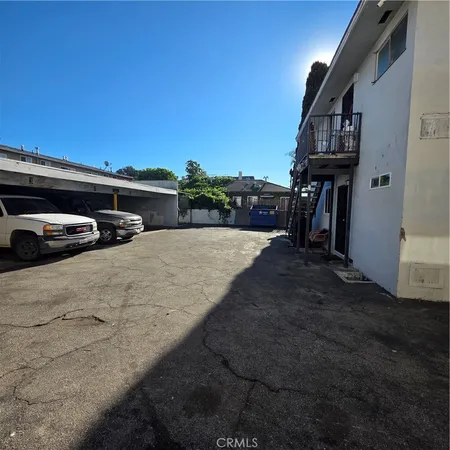 a view of street with parked cars