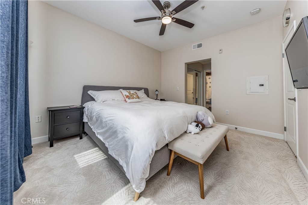 2366 Scholarship Irvine, CA 92612 - Photo 12 of 27 a bedroom with a bed and a chandelier