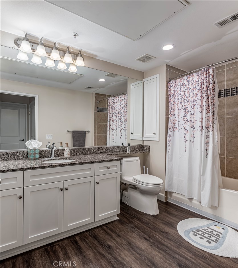 2366 Scholarship Irvine, CA 92612 - Photo 16 of 27 a bathroom with a toilet a sink and a mirror