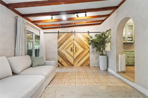 a living room with furniture and a rug