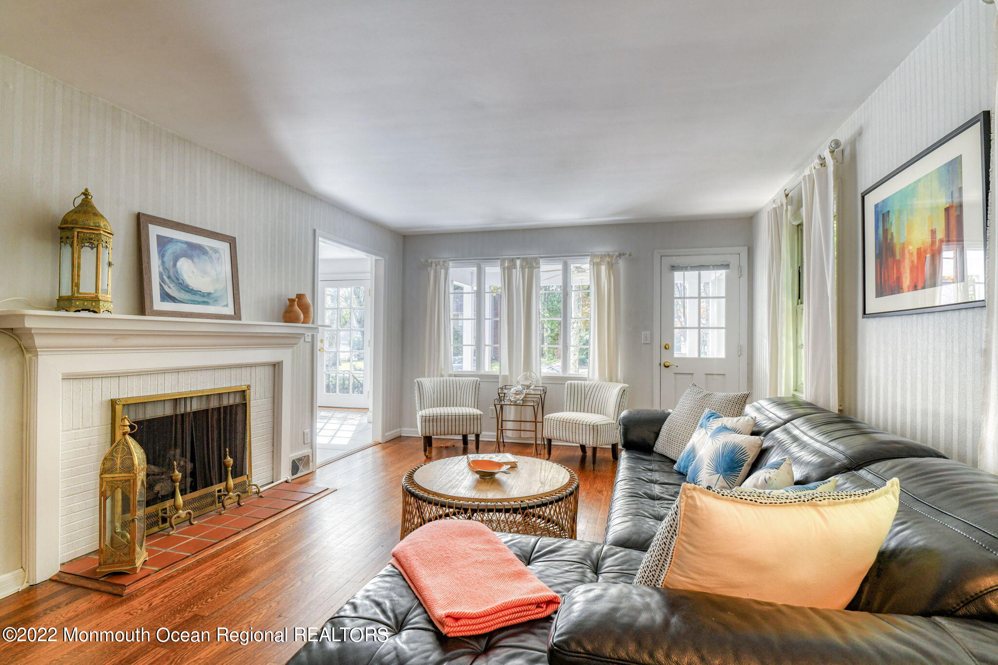 309 Bendermere Avenue Interlaken, NJ 07712 - Photo 11 of 37 a living room with furniture and a fireplace