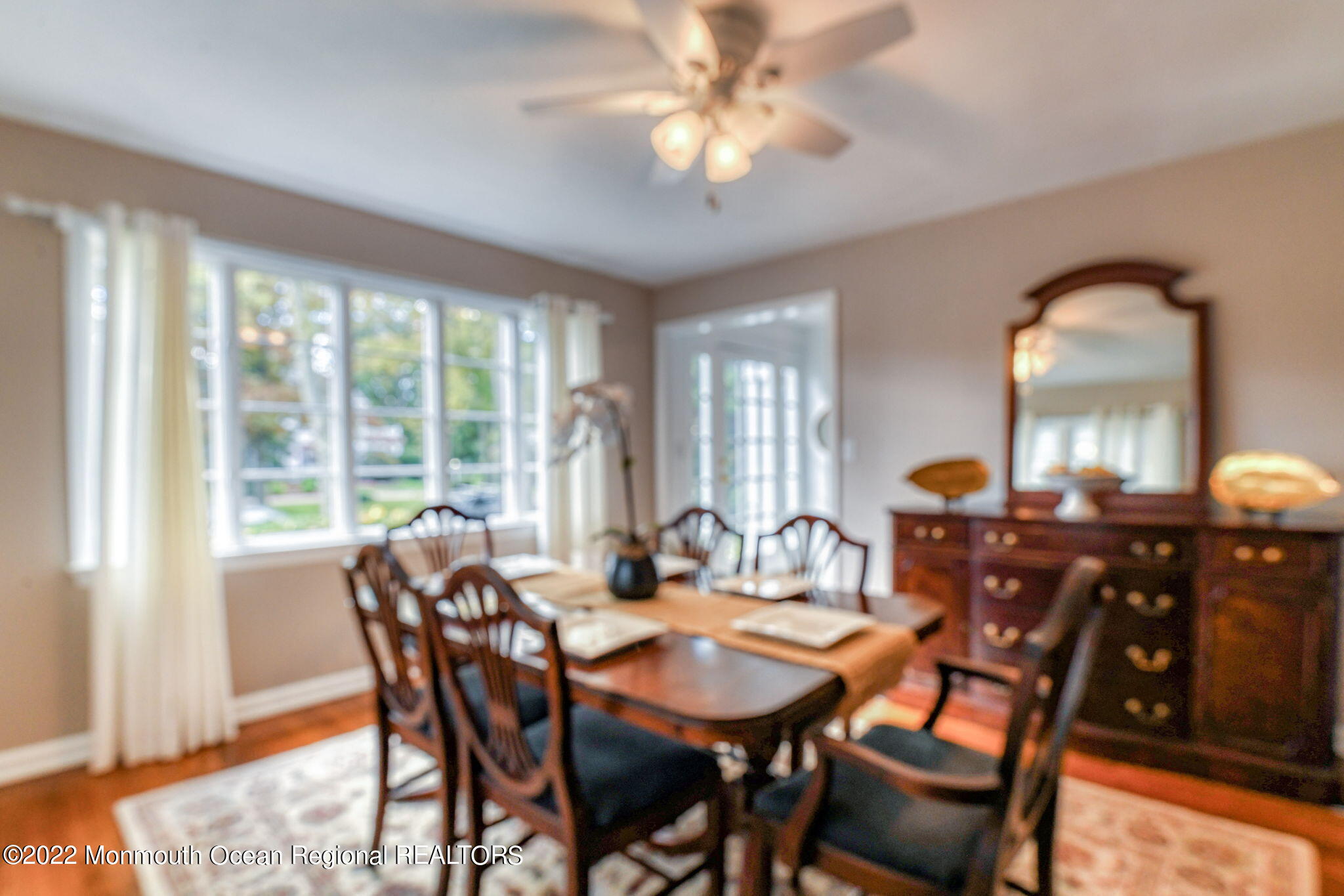 309 Bendermere Avenue Interlaken, NJ 07712 - Photo 15 of 37 a view of a dining room with furniture window and wooden floor