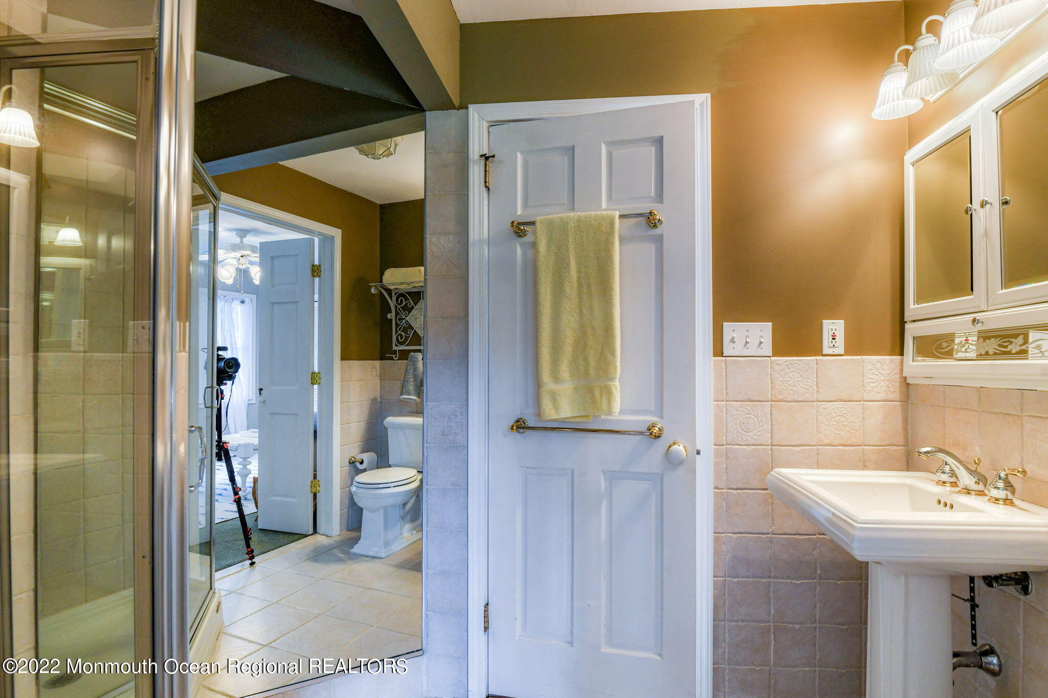 309 Bendermere Avenue Interlaken, NJ 07712 - Photo 22 of 37 a bathroom with a sink a toilet and shower