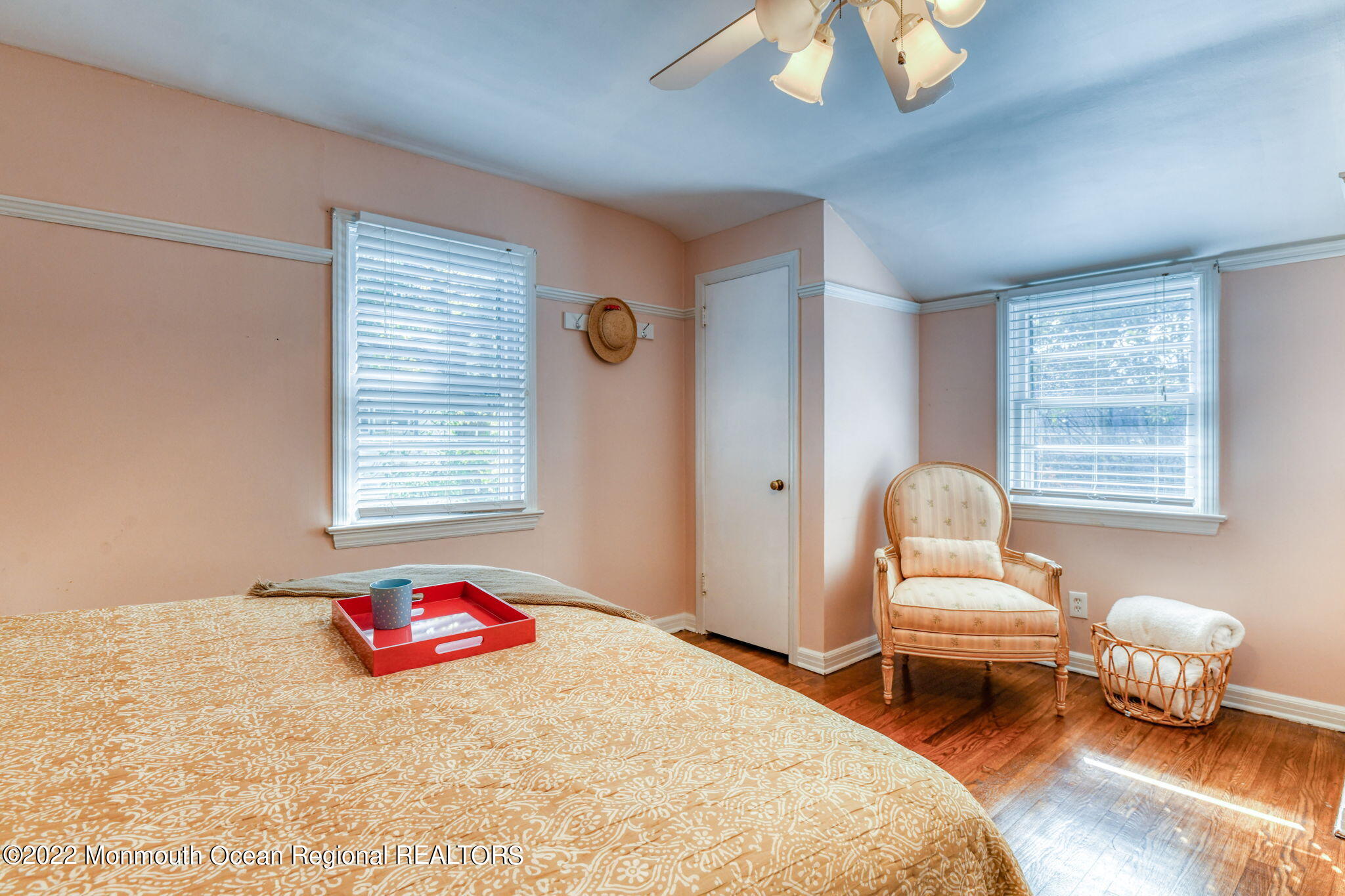 309 Bendermere Avenue Interlaken, NJ 07712 - Photo 27 of 37 a bedroom with a bed and a chair