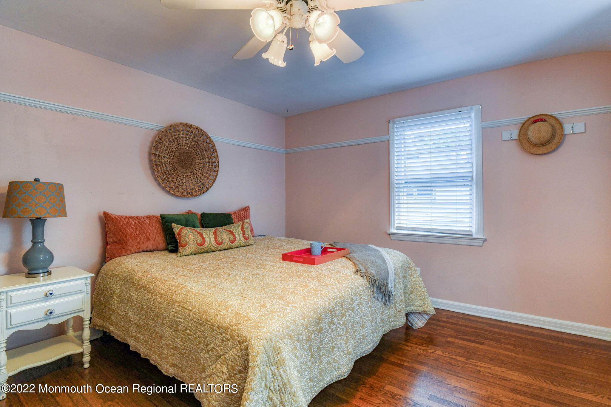 309 Bendermere Avenue Interlaken, NJ 07712 - Photo 28 of 37 a bed sitting in a bedroom next to a window