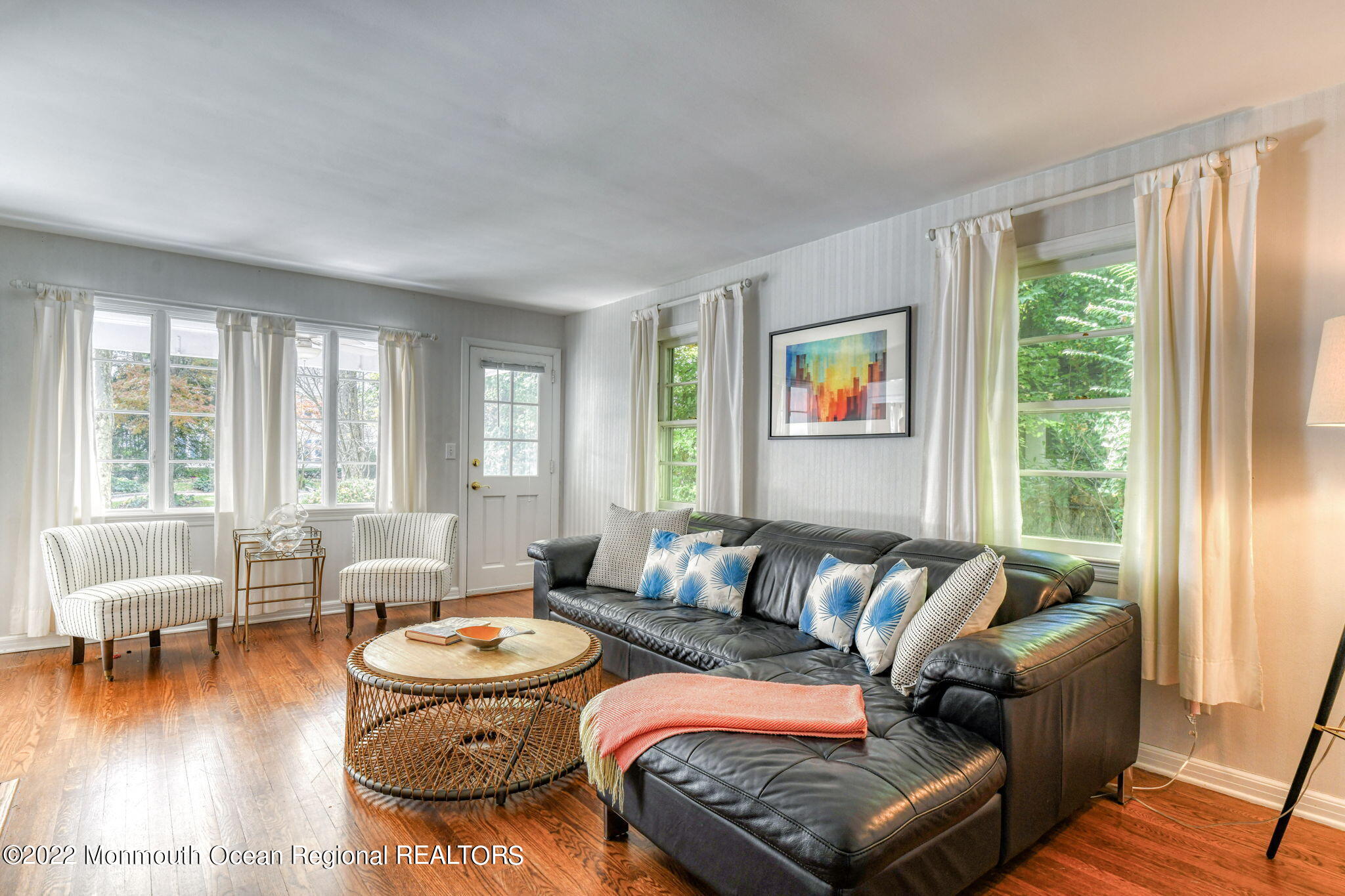 309 Bendermere Avenue Interlaken, NJ 07712 - Photo 9 of 37 a living room with furniture and a large window